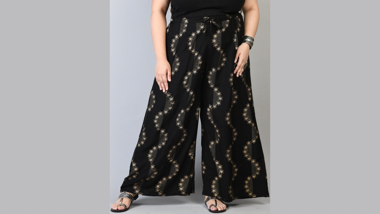 PrettyPlus by Desinoor.com Women Plus Size Black & Gold-Toned Floral Printed Palazzos
