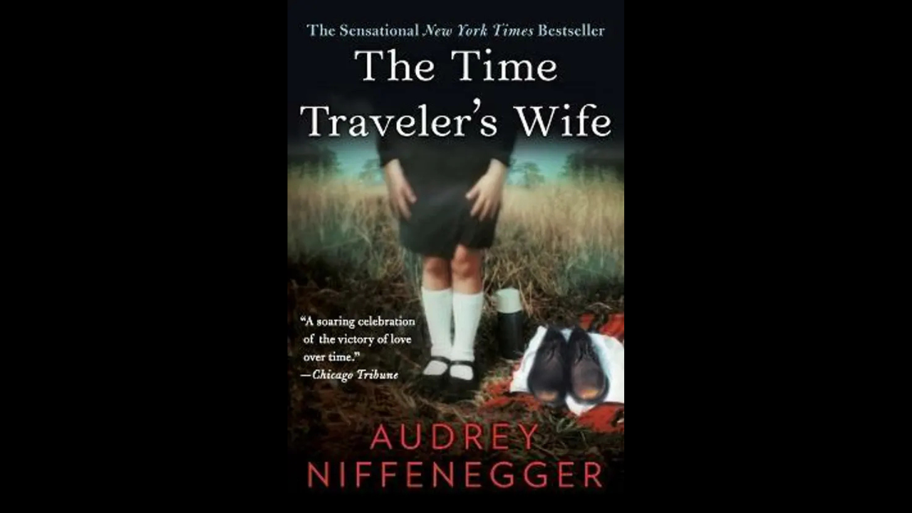 Soft-toned book cover of The Time Traveler’s Wife featuring an empty pair of shoes and a vintage feel.